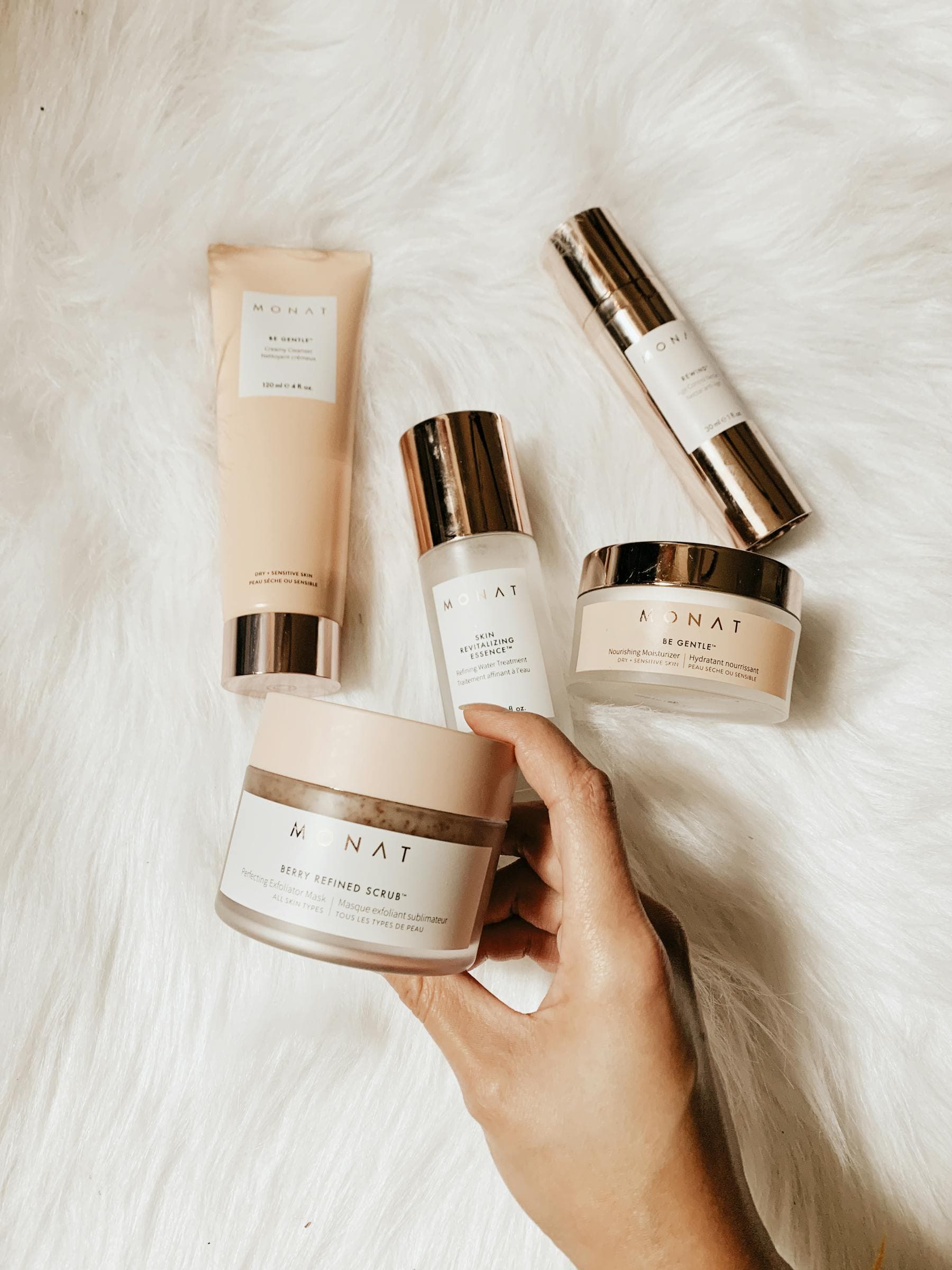 A skincare ritual — warm light illuminating delicate skincare tools and botanical ingredients