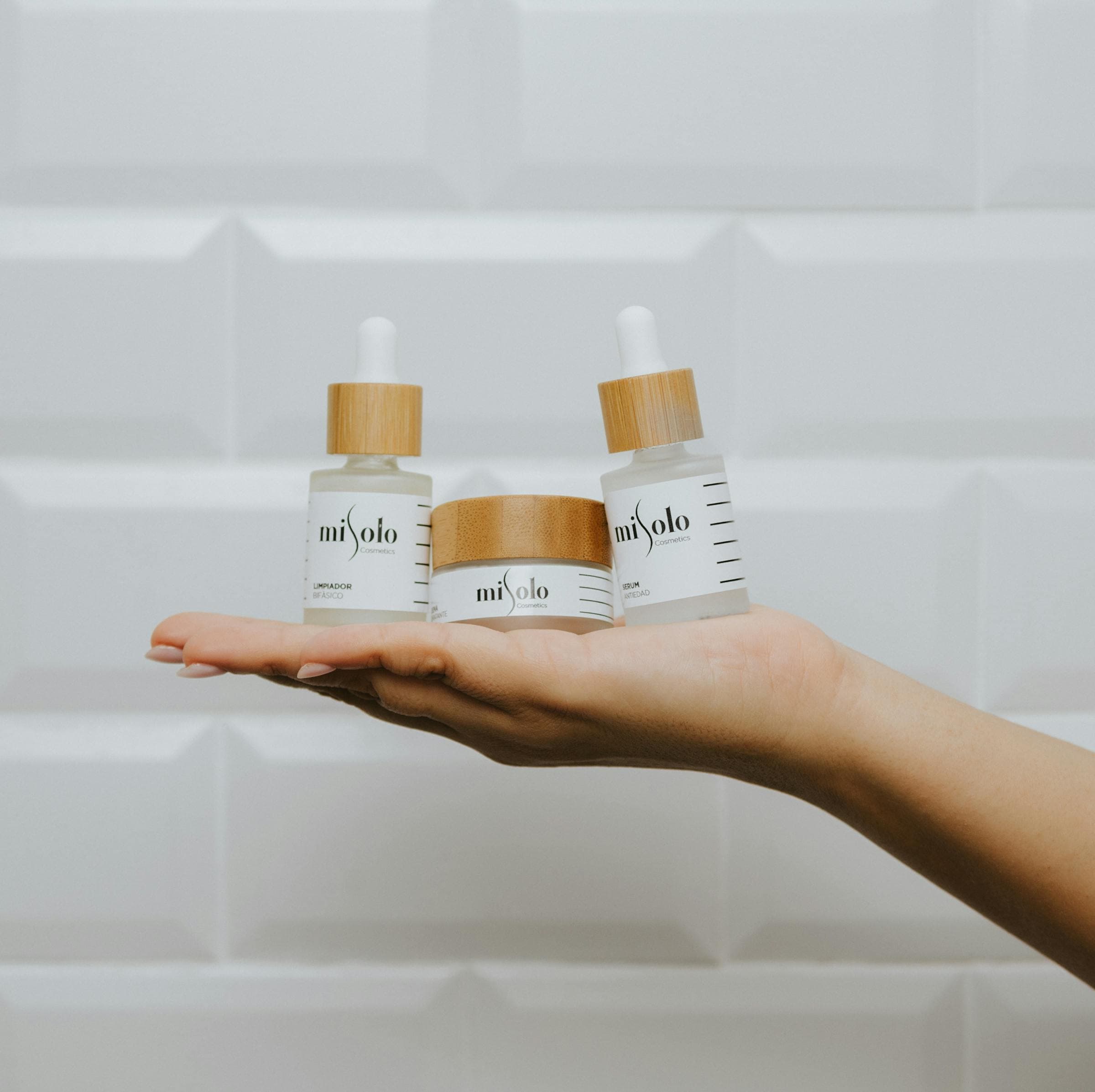 Hand with golden serum oil