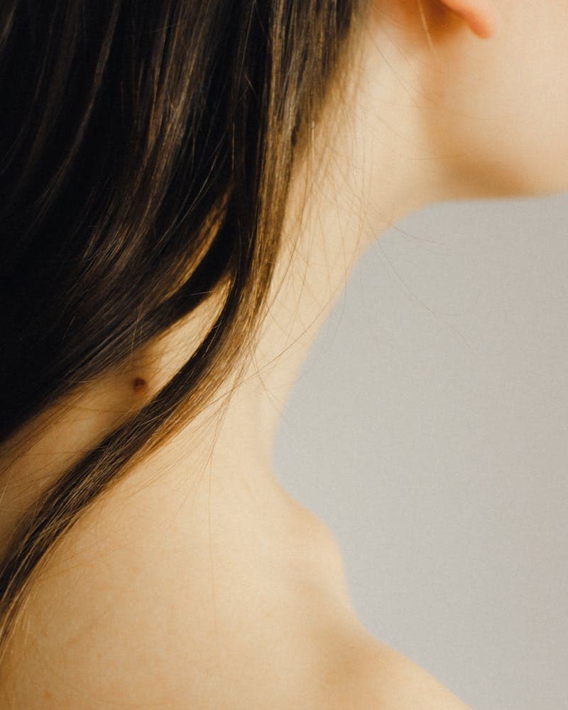 Glowing neck and shoulder in warm light