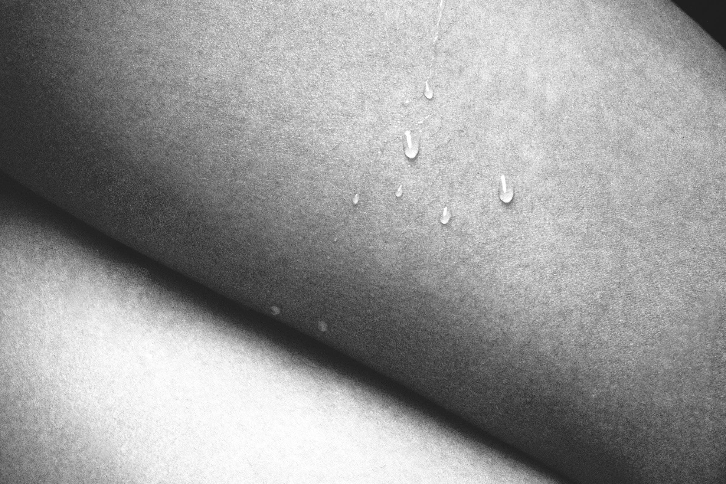 Water droplets on warm amber surface